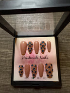 Sapphire Socialite nude press on nails with blue rhinestones