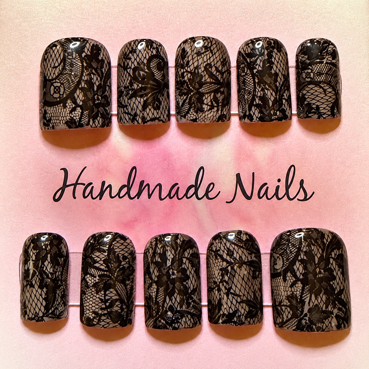 Close-up of Black Lace press-on nail set