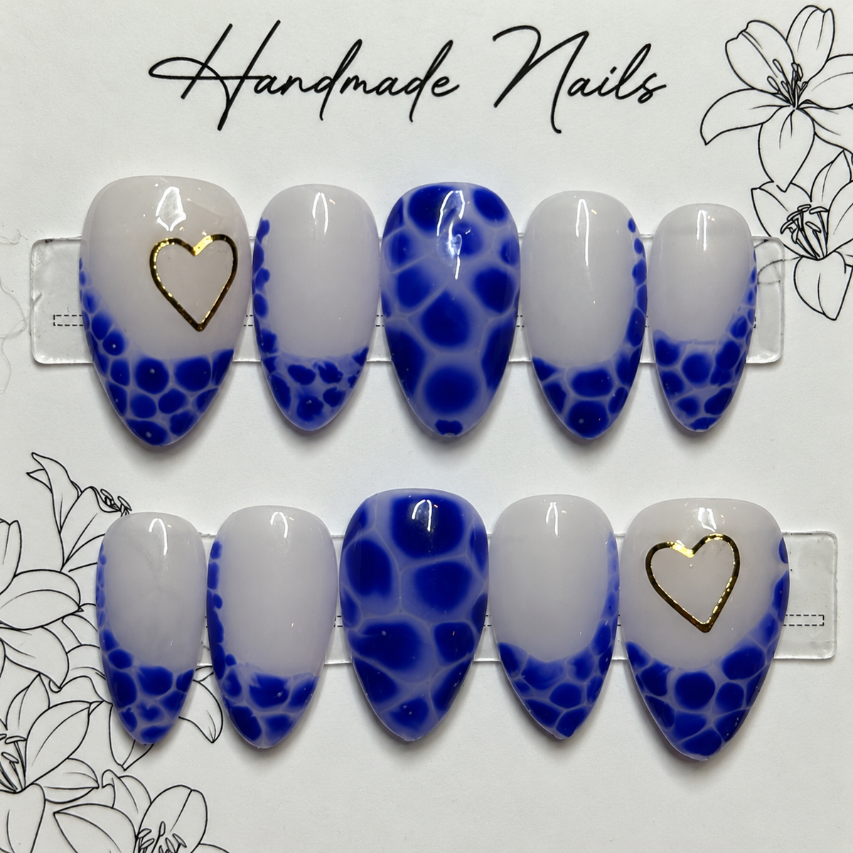 Close-up of Cobalt Lace Hearts press-on nail set