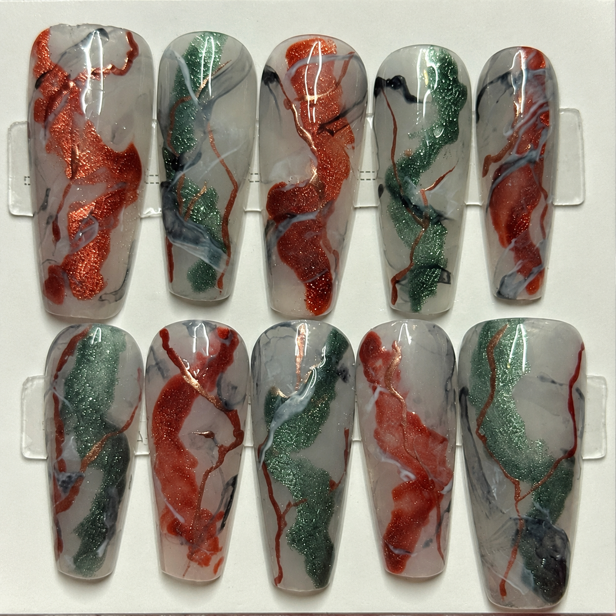 Close-up of Copper Sage Marble press-on nail set