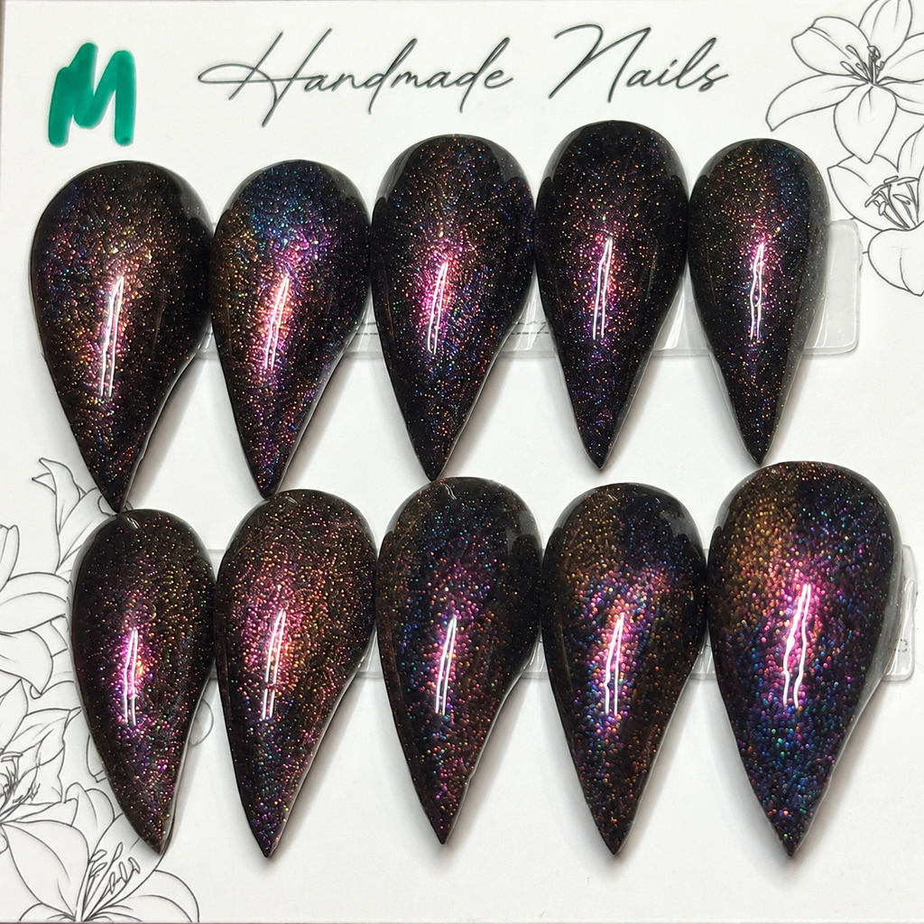Close-up of Cosmic Ember Claws press-on nail set