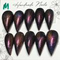 Close-up of Cosmic Ember Claws press-on nail set