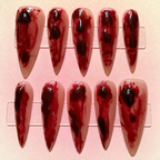 Close-up of Crimson Veil press-on nail set