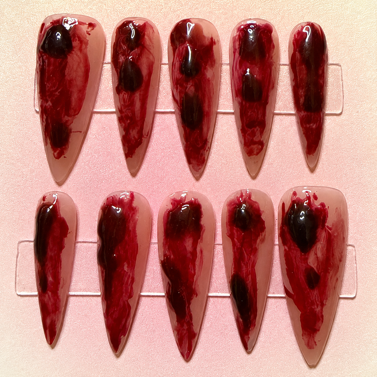 Close-up of Crimson Veil press-on nail set