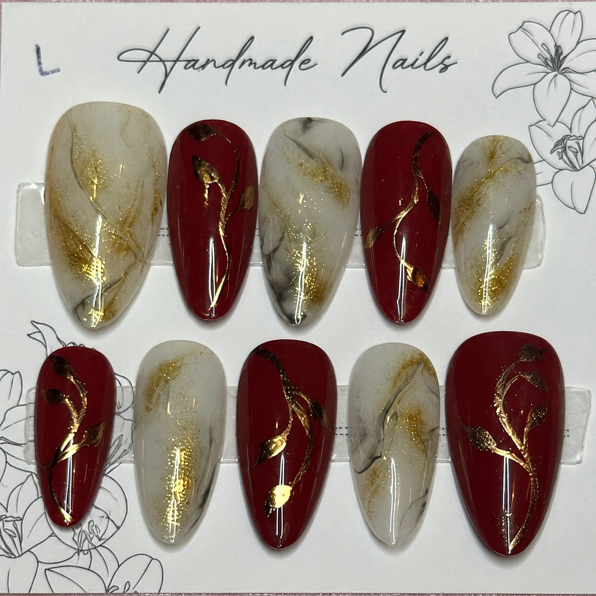 Close-up of Merlot Gold Marble press-on nail set