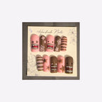 Playful pink and cocoa-brown cartoon monster faces, whimsical stars, and coordinating stripes.