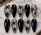 Rockstar handmade press-on nails with glossy black nails and smoky grey nails with black glitter stars