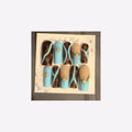 Turquoise blue, tortoiseshell swirls, fine gold accents, and radiant starbursts.
