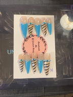 Turquoise Wild handmade press-on nails with bright turquoise French tips, nude zebra print and crystal accents
